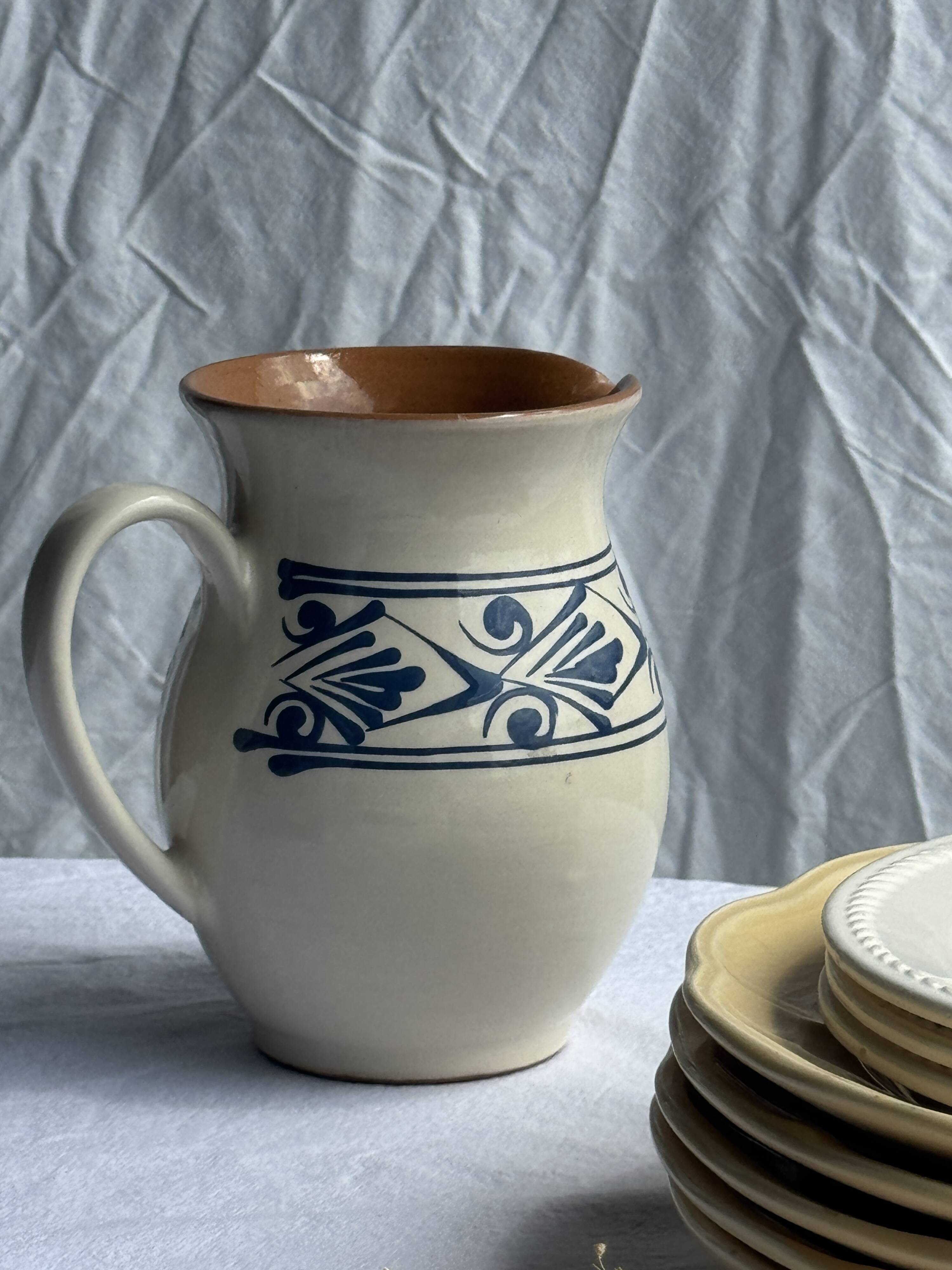 Vintage white pitcher with stylized blue plant frieze H17.5