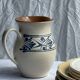 Vintage white pitcher with stylized blue plant frieze H17.5
