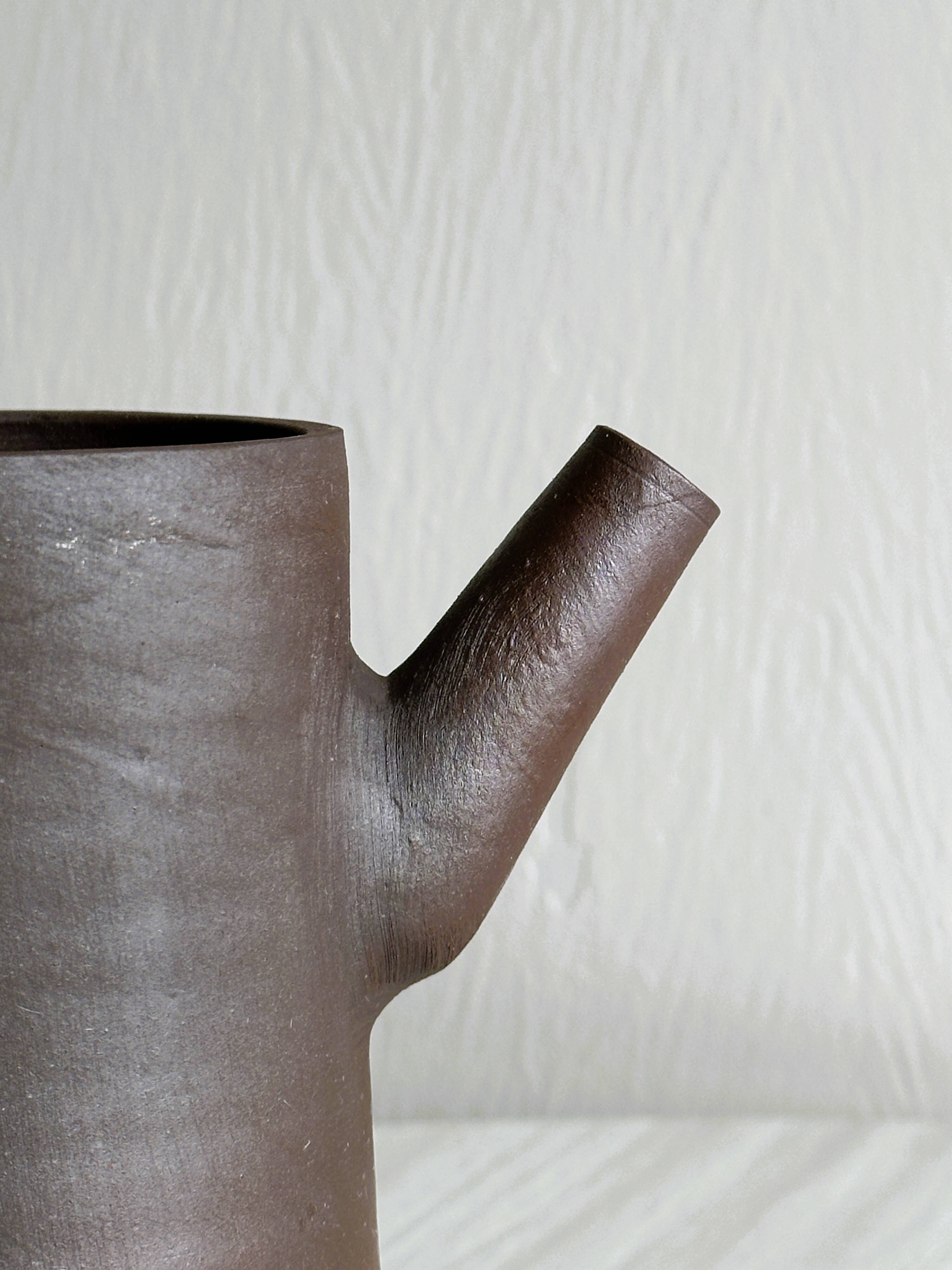 Small pitcher in brown glazed stoneware