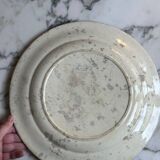 Plat rond en terre de fer à décor d'oiseaux