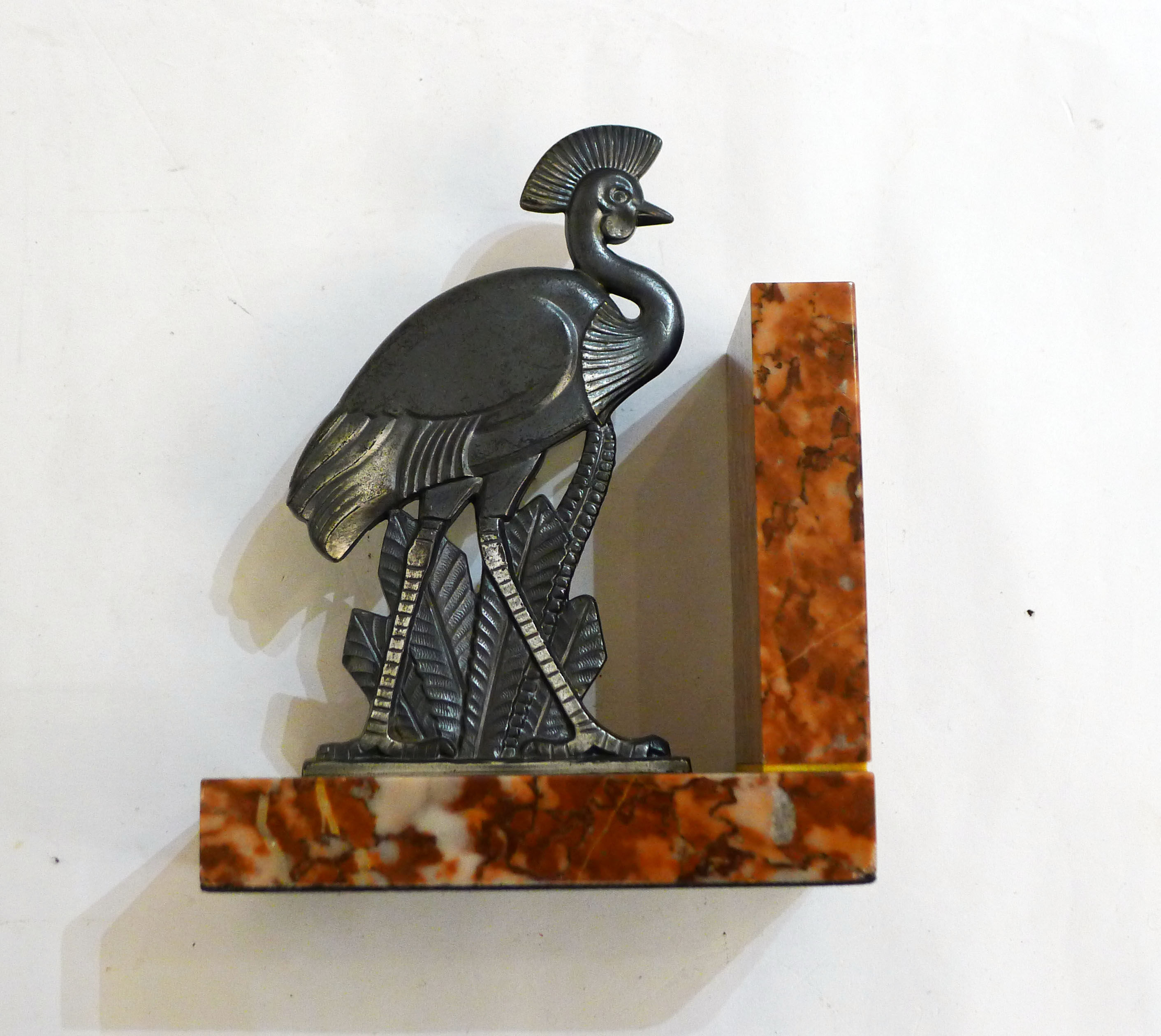 Art Deco bird bookend on marble