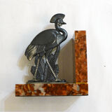 Art Deco bird bookend on marble