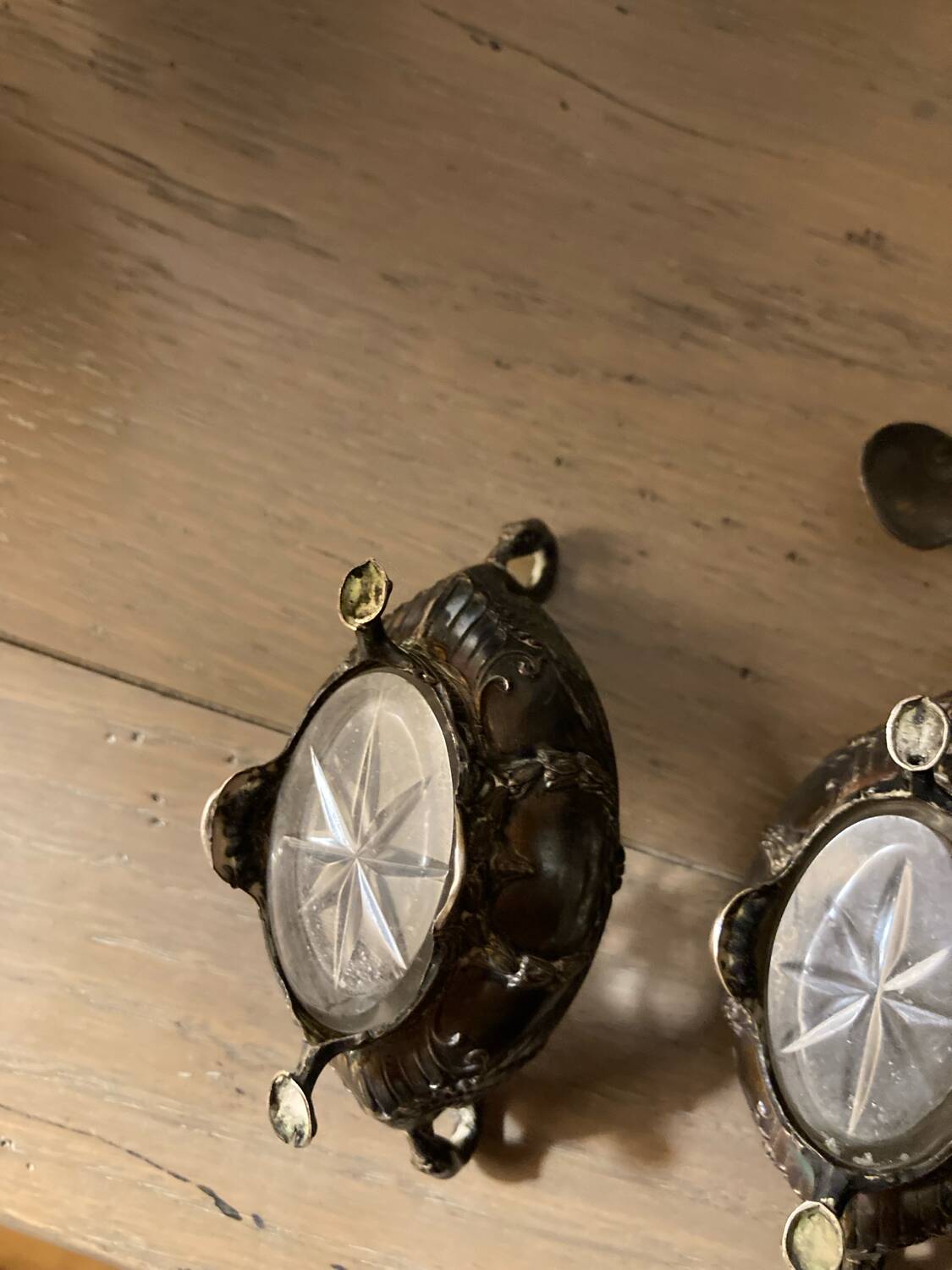 Salt and pepper shakers with silver spoons