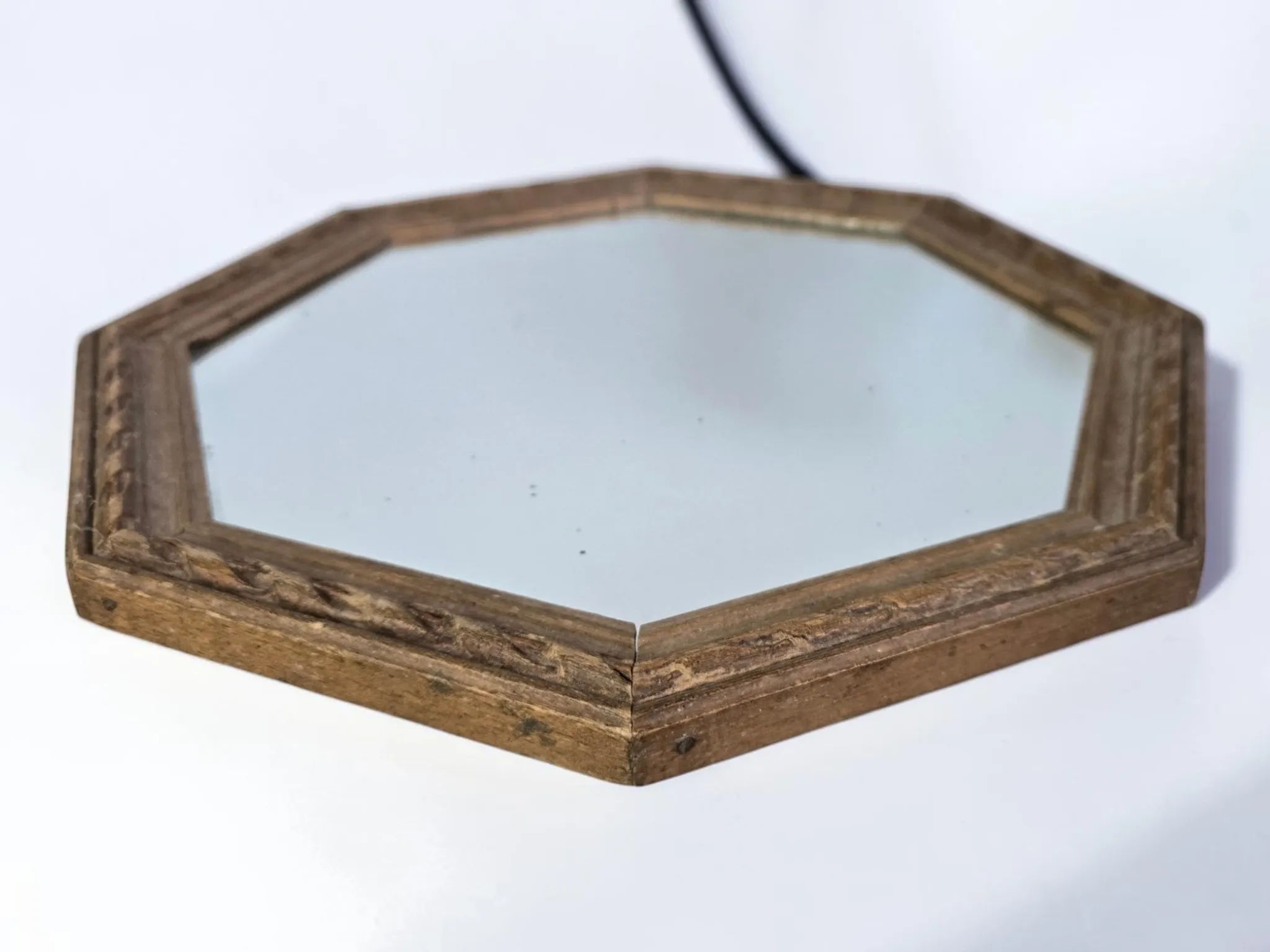 Octagonal mirror in carved wood
