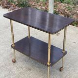 Brown rosewood rolling table with gold legs