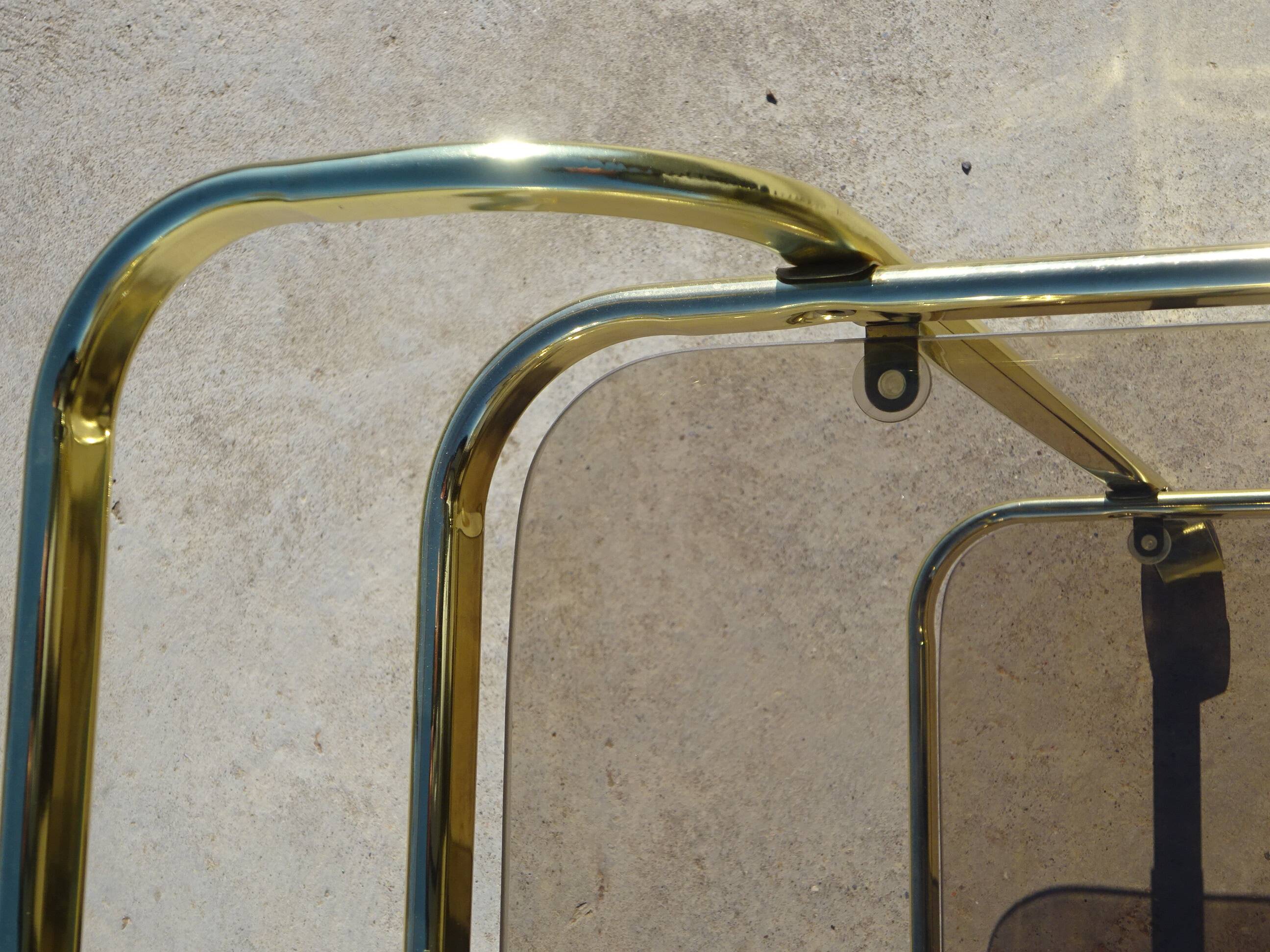 Golden metal and smoked glass dessert table
