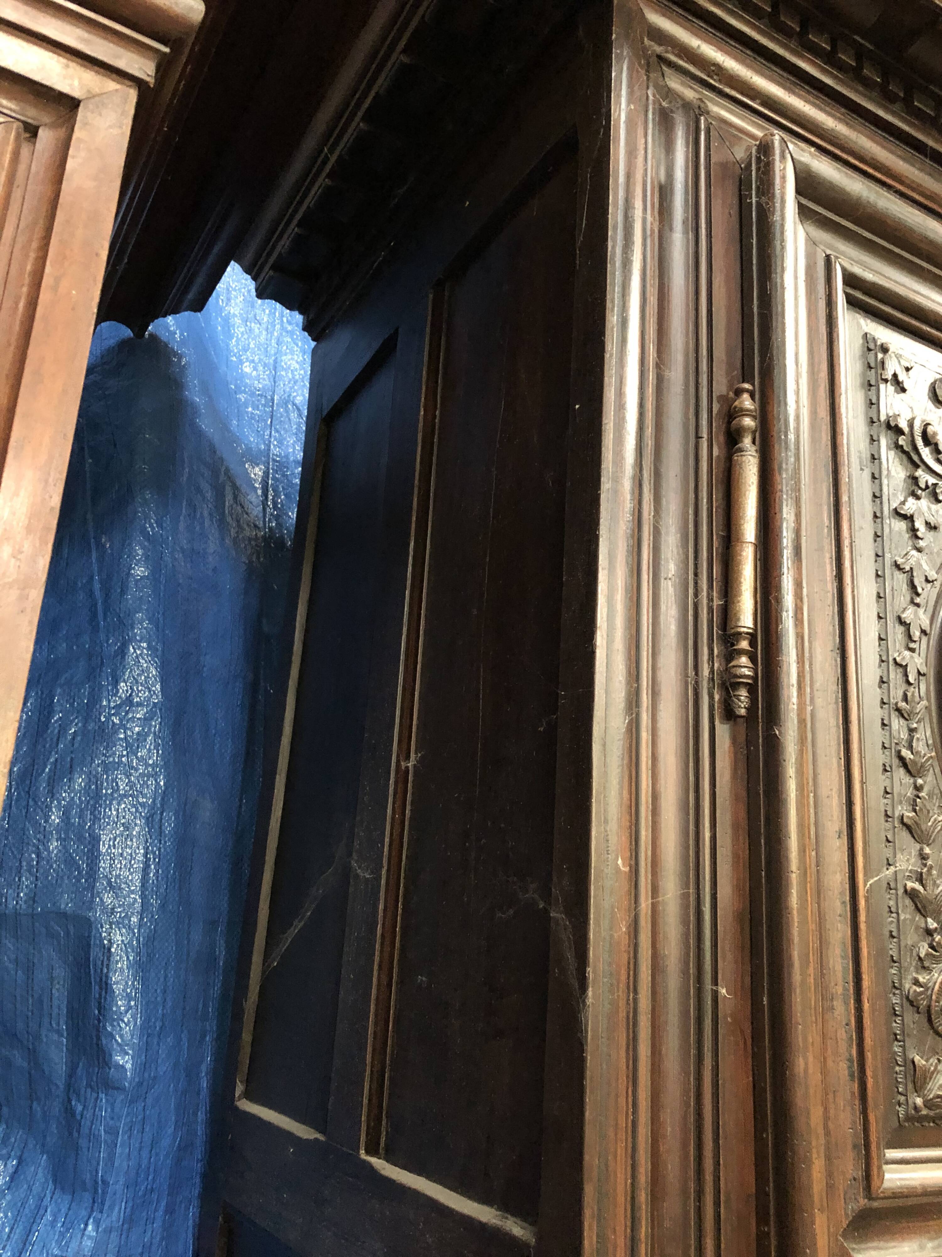 Antique Louis XIII armoire in solid walnut with carved doors