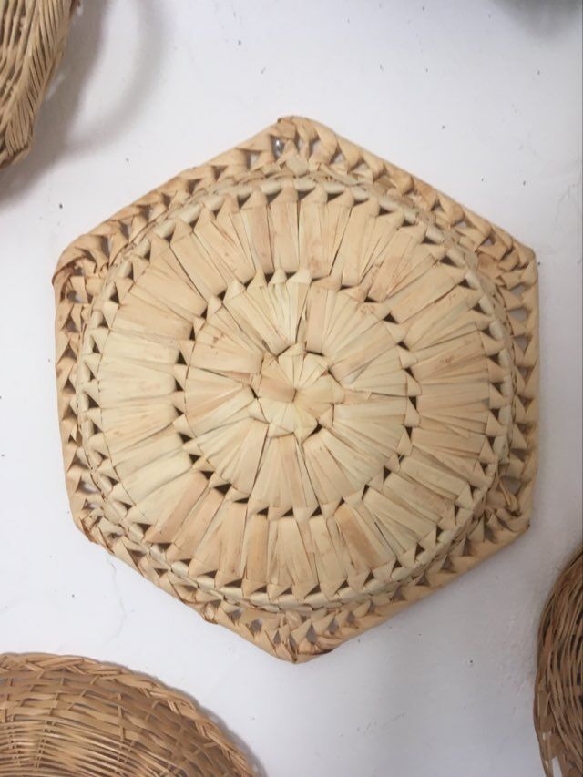 Wall composition of 9 wicker baskets and trays.