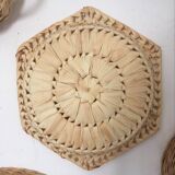 Wall composition of 9 wicker baskets and trays.
