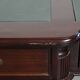 Partner desk in English style with dark wood and a green leather top