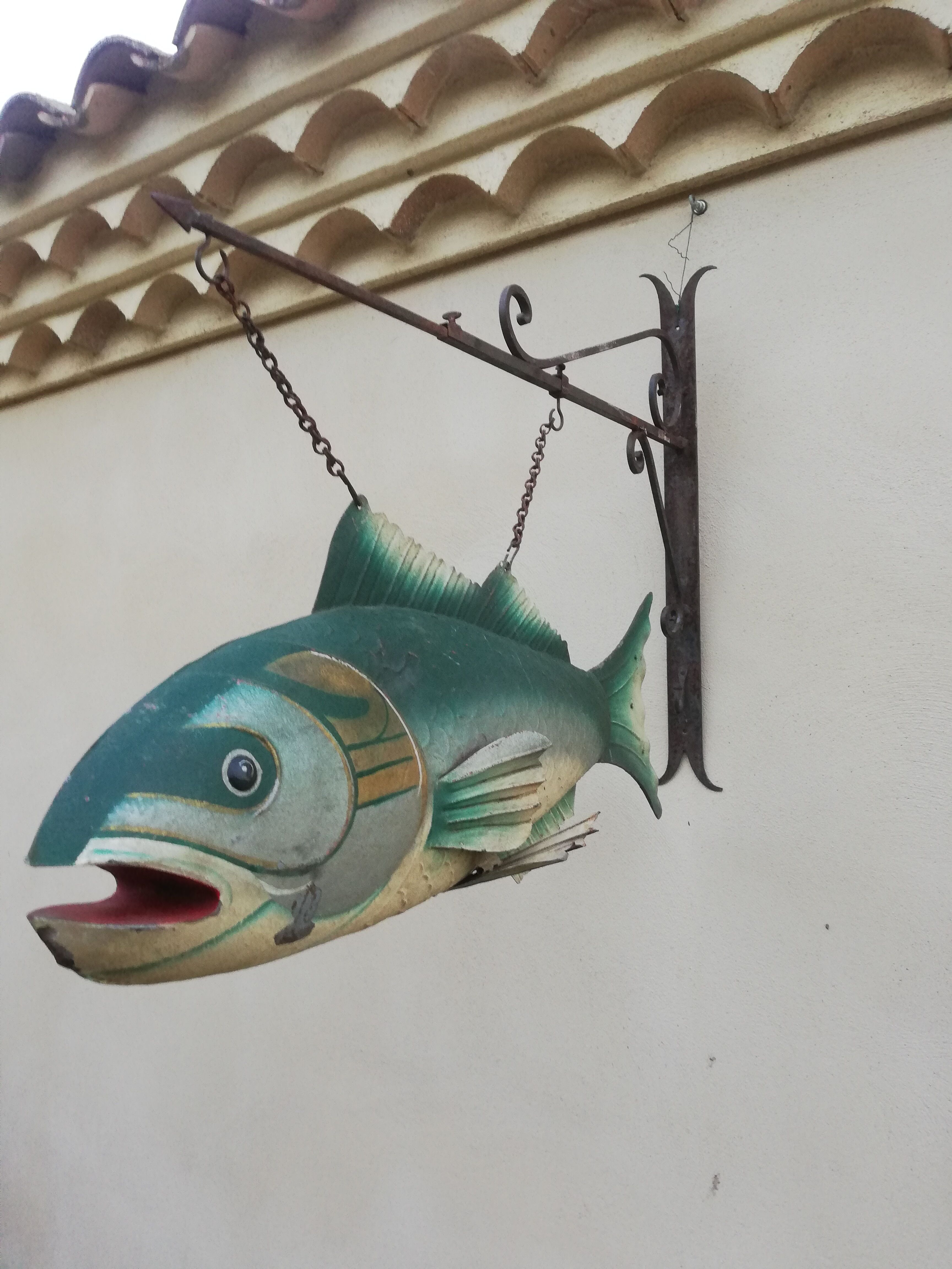 Panel depicting a fish in sheet metal