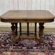 Henri II walnut table from the early 20th century with extensions.
