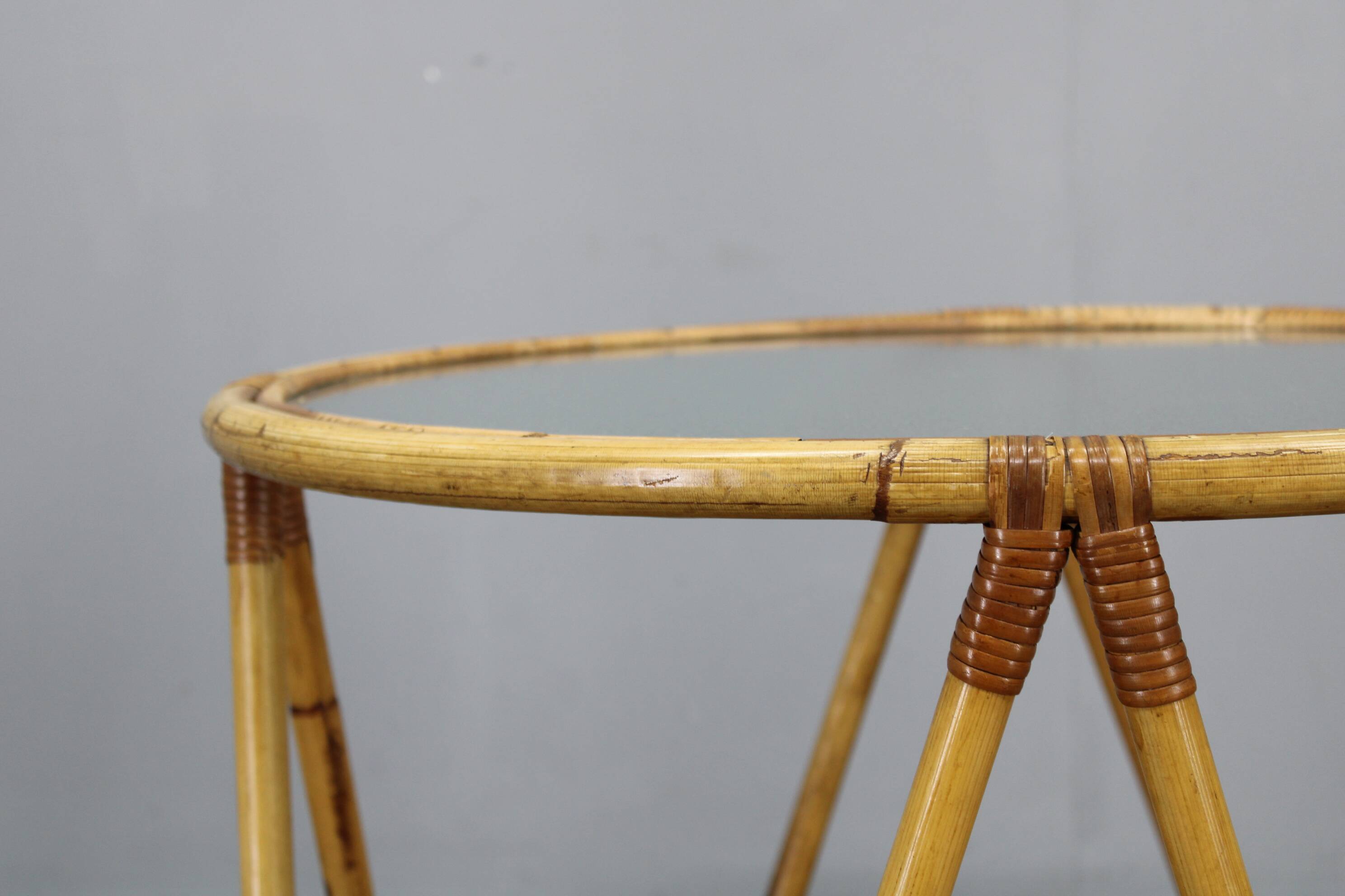 1960s Italian rattan coffee table with glass top, mid-century round design
