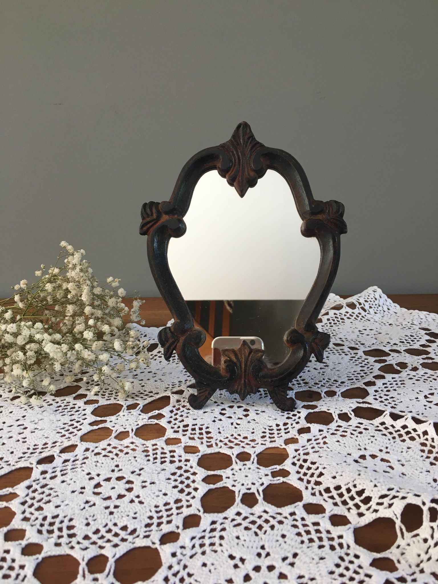 Vintage fiddle mirror to put down.