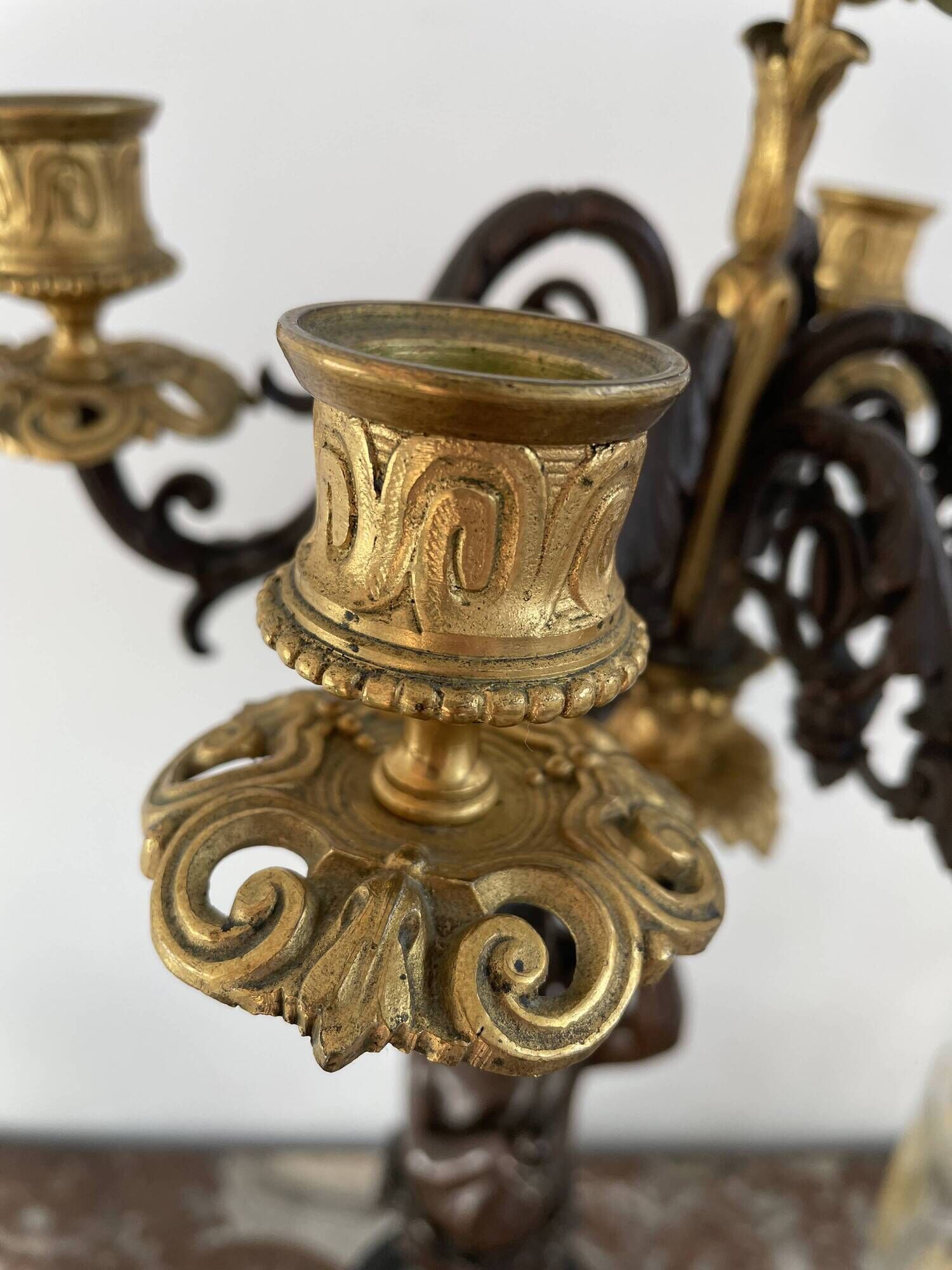 Candelabra with cherub in patinated bronze