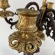 Candelabra with cherub in patinated bronze