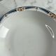 Longwy salad bowl with blue and orange floral decoration.
