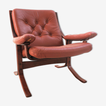 Scandinavian armchair made of wood and cognac leather