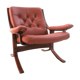 Fauteuil scandinave en bois et cuir cognac