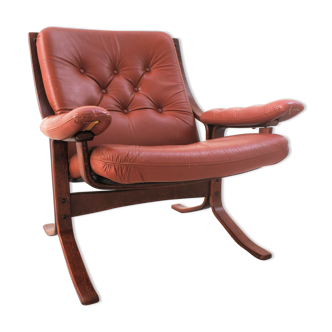 Scandinavian armchair made of wood and cognac leather