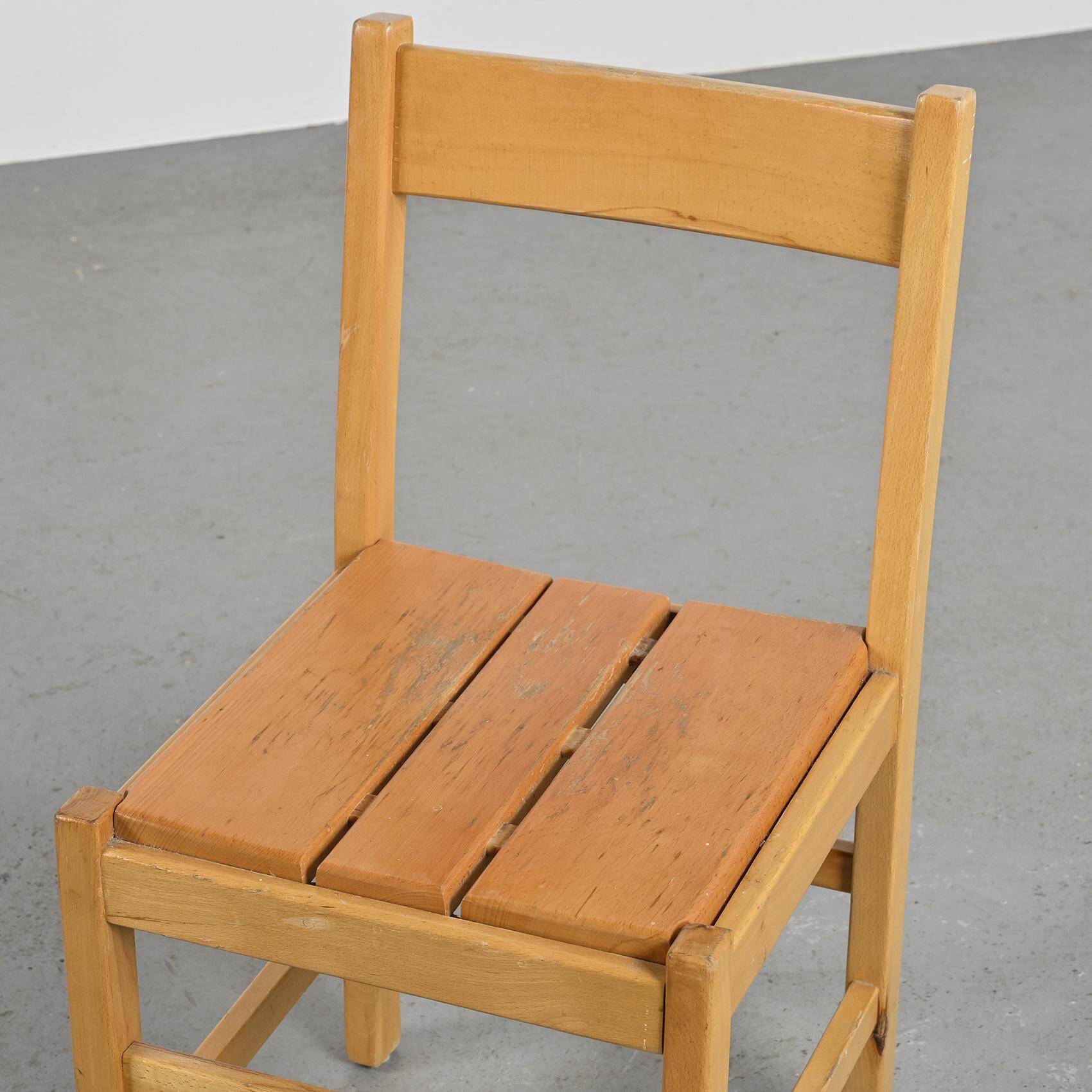 Suite of four chairs in the style of Maison Regain