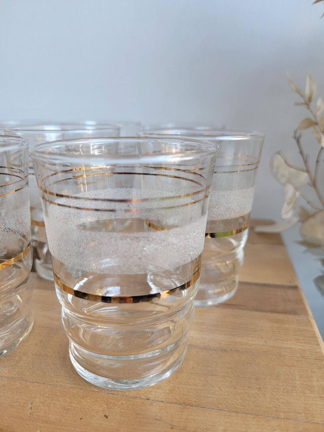 Set of 11 granite glass cups and golden edging