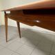Console from the 1950s with a pink marble top and a cherry wood frame.