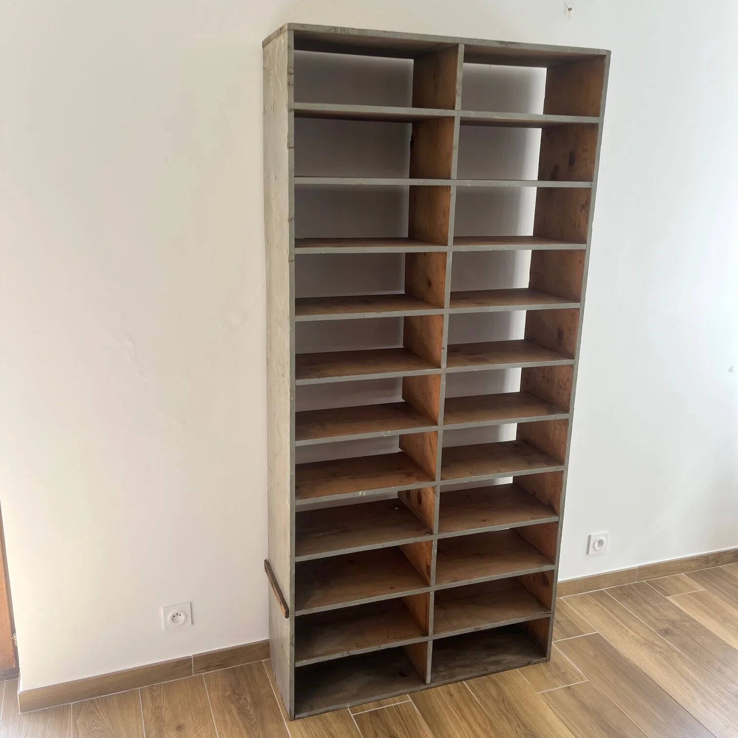 Large antique workshop cabinet with patinated wooden compartments, 20th century.