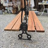 Antique double garden bench from the city of Paris in cast iron and wood