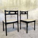 Set of six black lacquered wooden chairs.