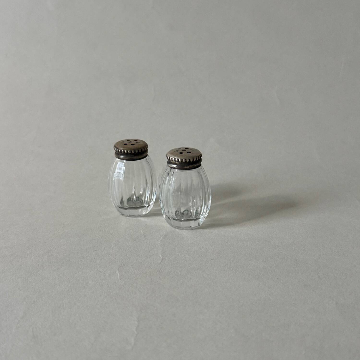 Pair of vintage Christofle glass and silver pearl salt cellars