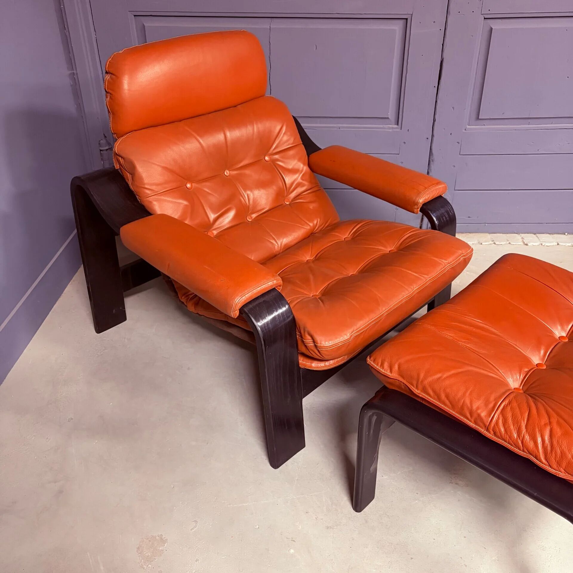 Vintage 1970s armchair with ottoman, leather and wood