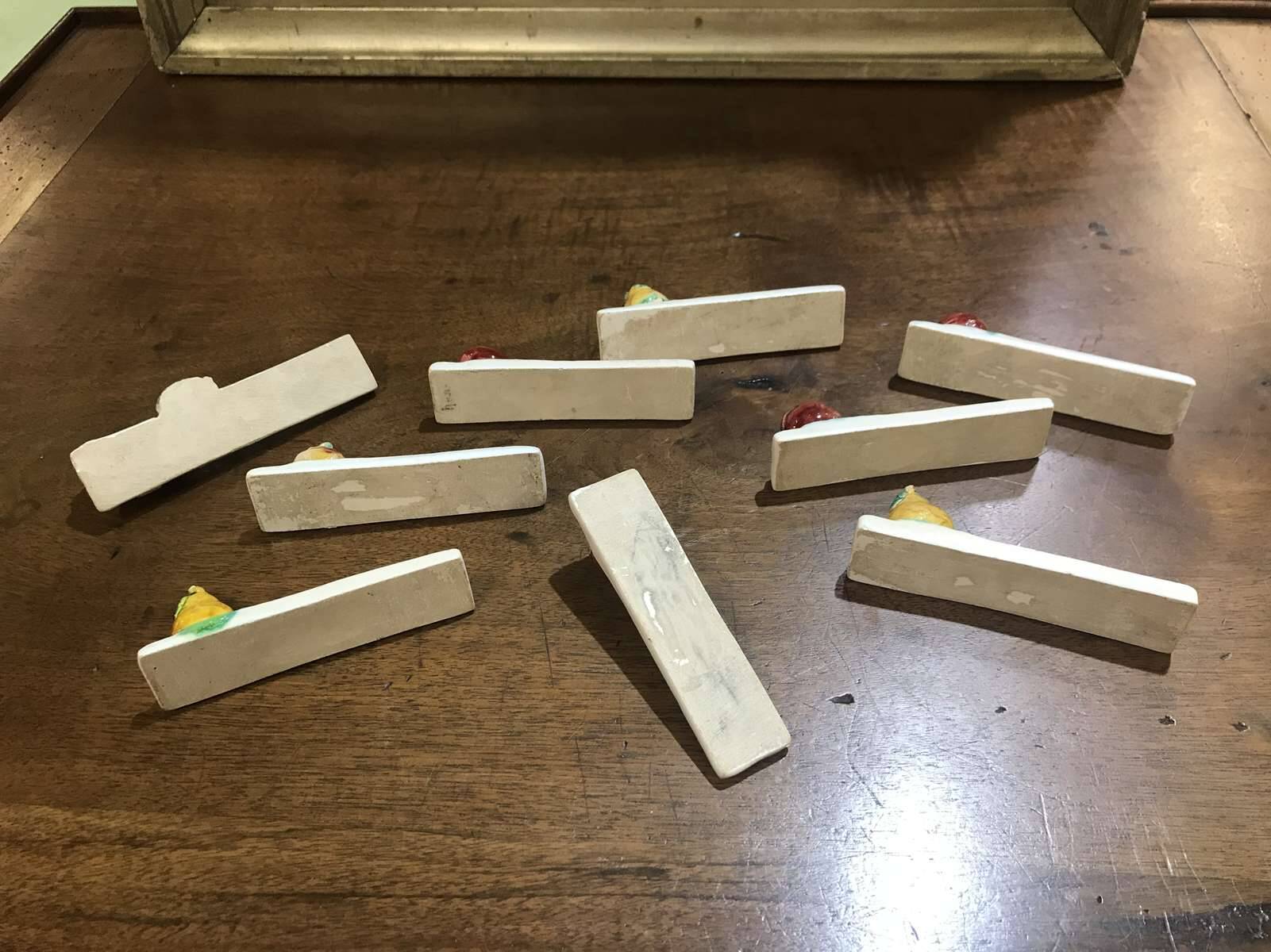 Set of 9 fruit-decorated knife rests from the 1930s.