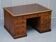 Antique Victorian oak kneehole desk with 18 double-sided drawers.