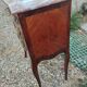 Antique marquetry commode with marble top in Louis XVI style.