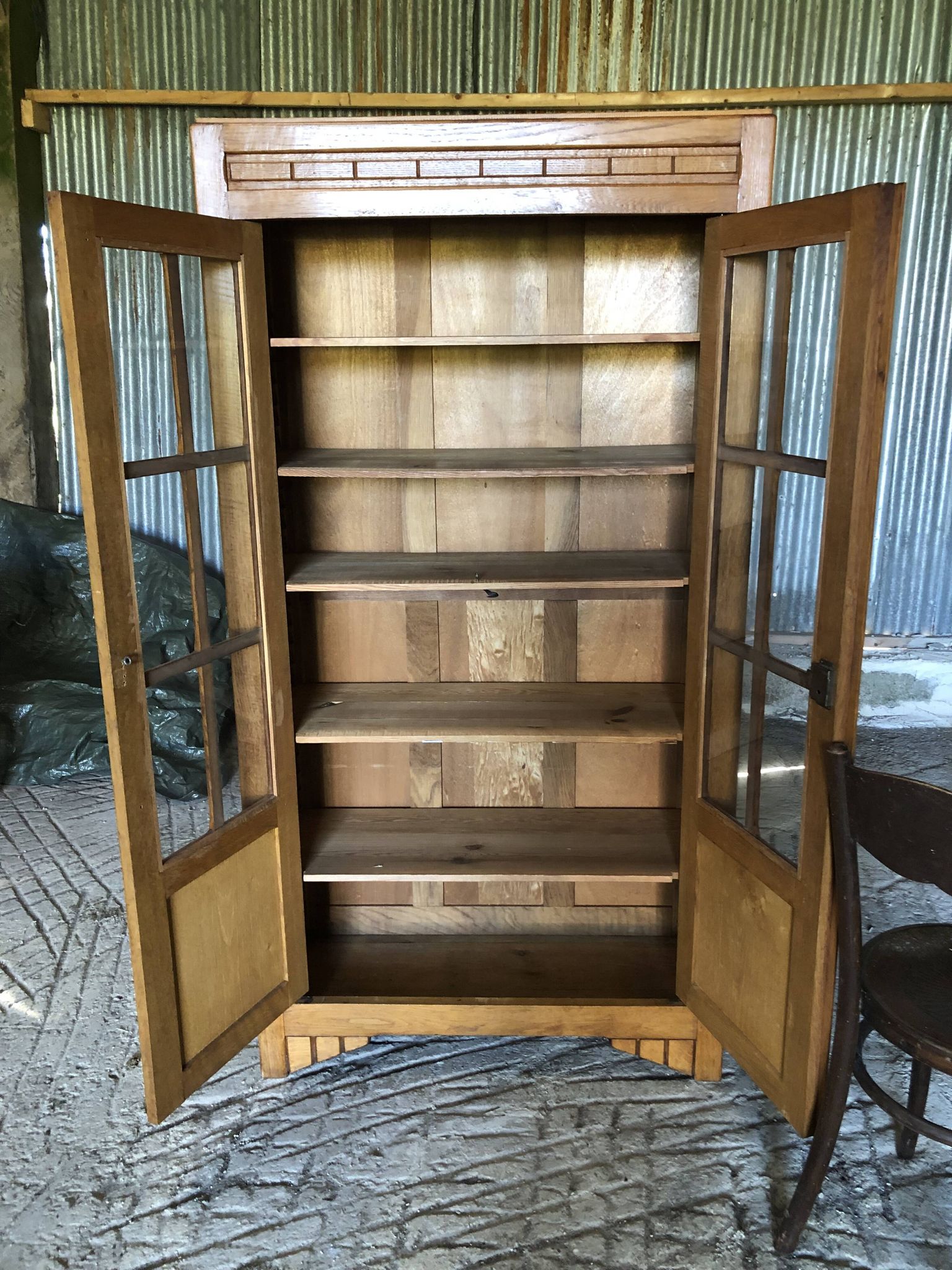 Vintage oak bookcase from the reconstruction period with 2 doors with small panes.