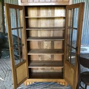 Vintage oak bookcase from the reconstruction period with 2 doors with small panes.