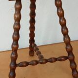 Beaded leg tripod stool