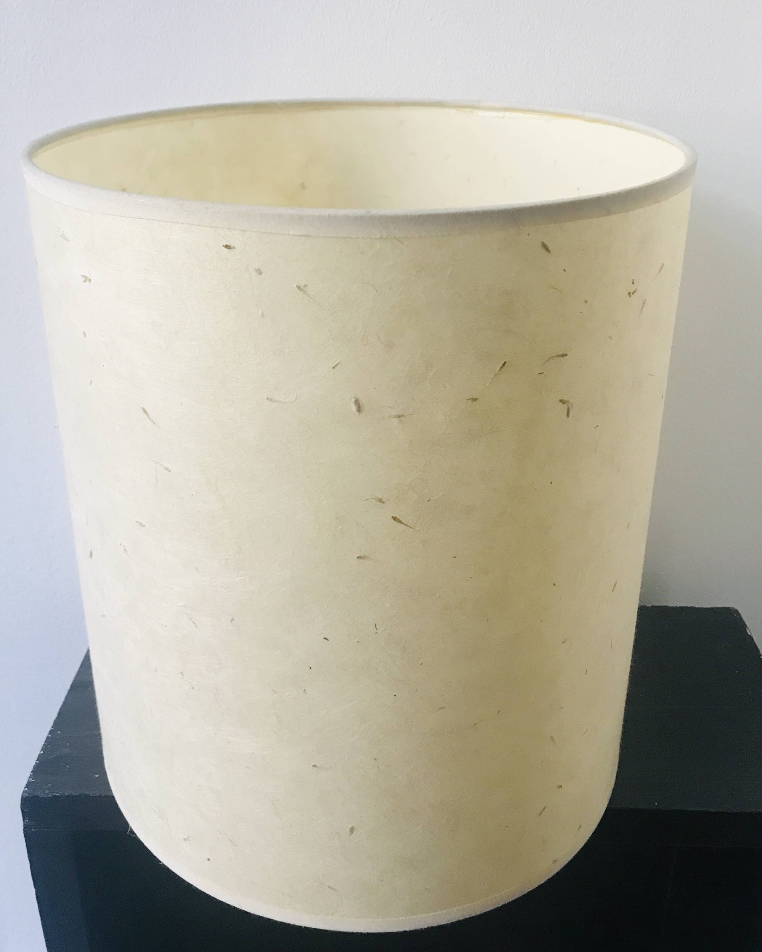 Table lamp with rattan base and papier-mâché hat