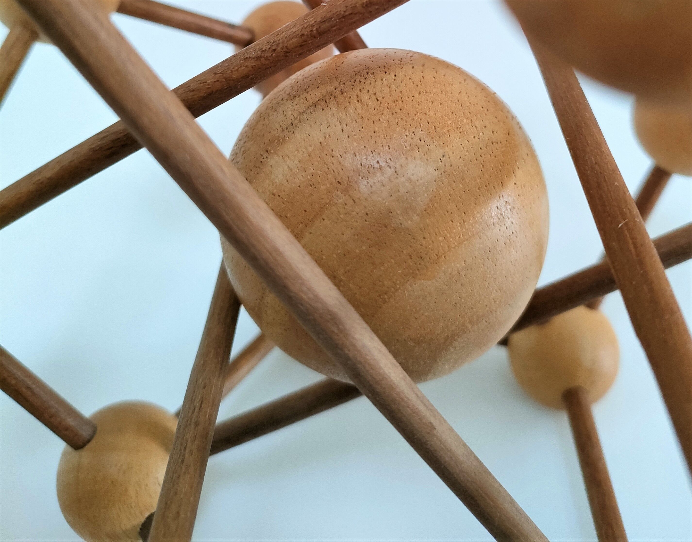 Sculptural modeling of a solid wood atom contemporary design