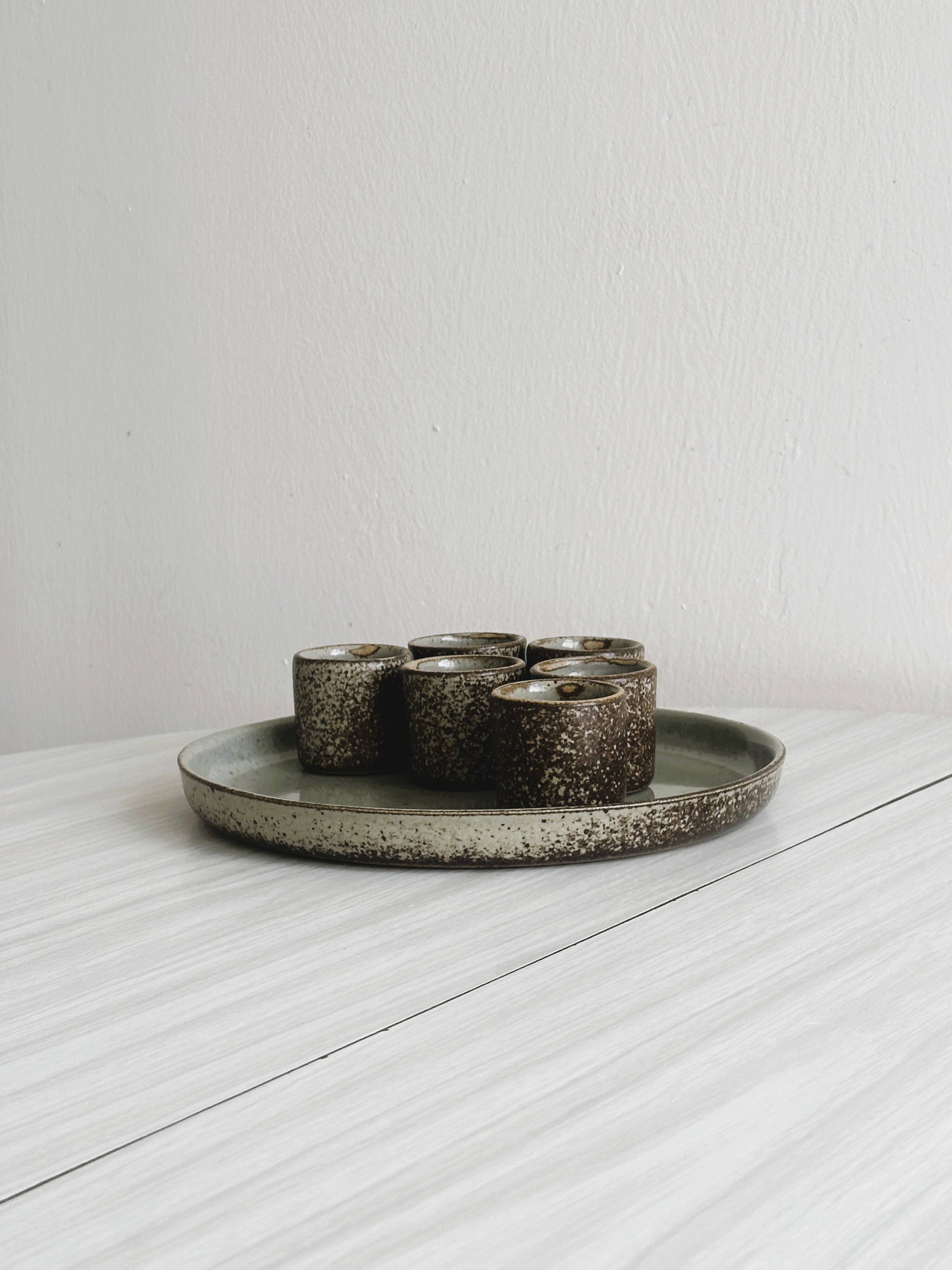 Handcrafted stoneware set of 6 liqueur glasses and matching plate