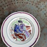 Collectible plate painted by Henry Simon, market gardening at the inn, in enameled ceramic,