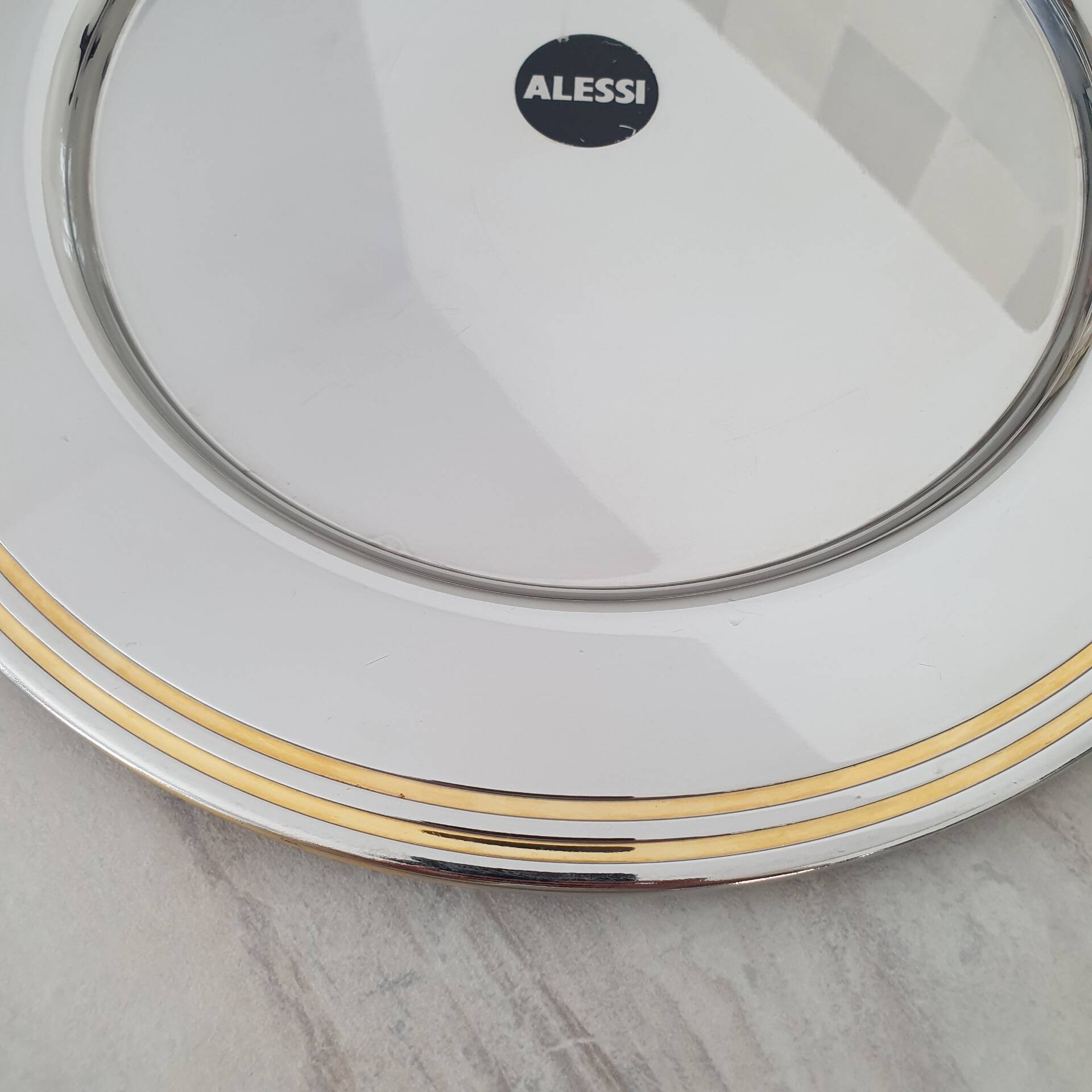 Alessi Ettore Sottsass / Assiette de service inox 18/10 et doré NG5100