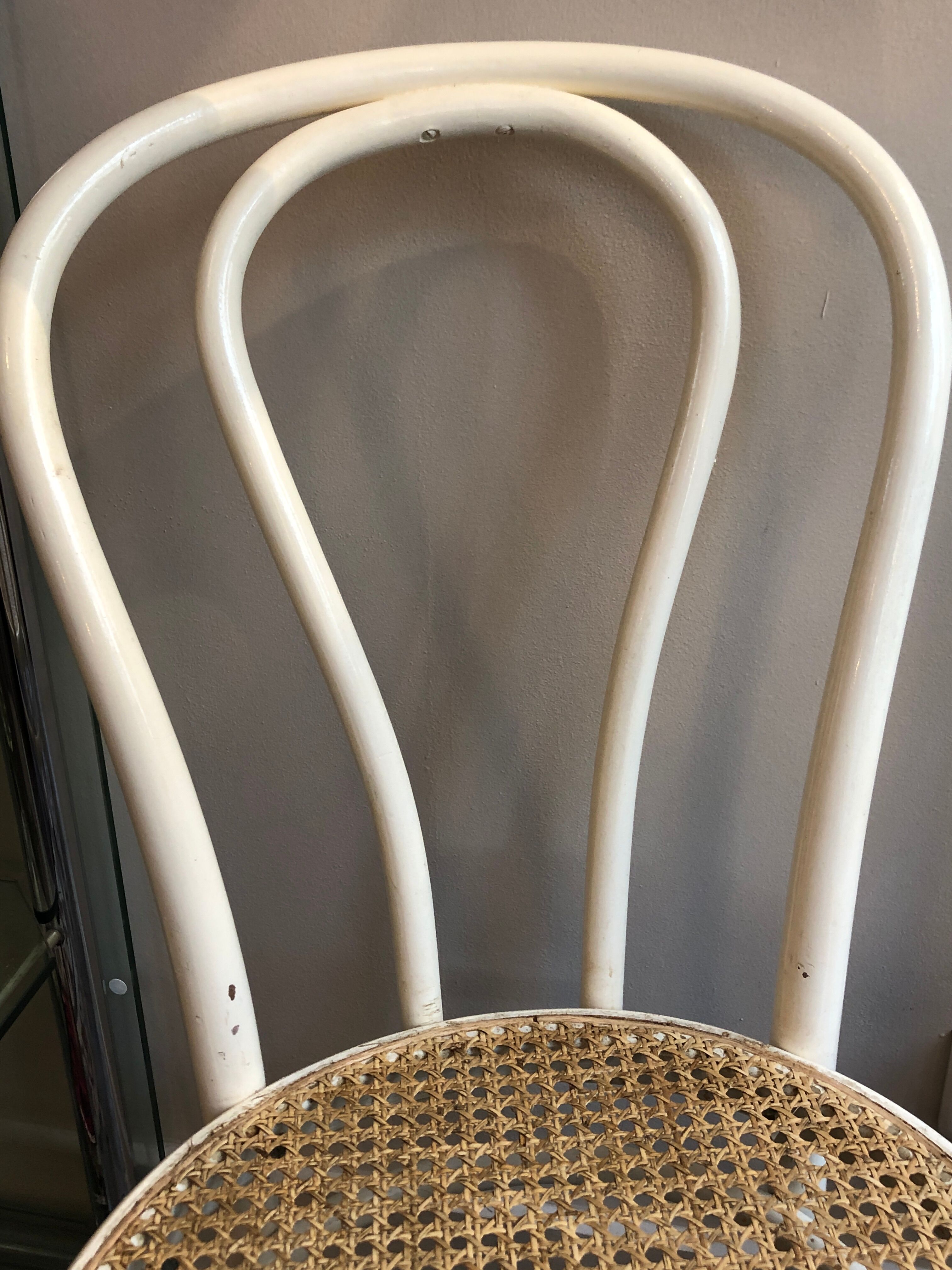 Couple of white bistro chairs
