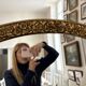 Large vintage gold mirror in Louis XVI style – fluted frame and floral decoration.