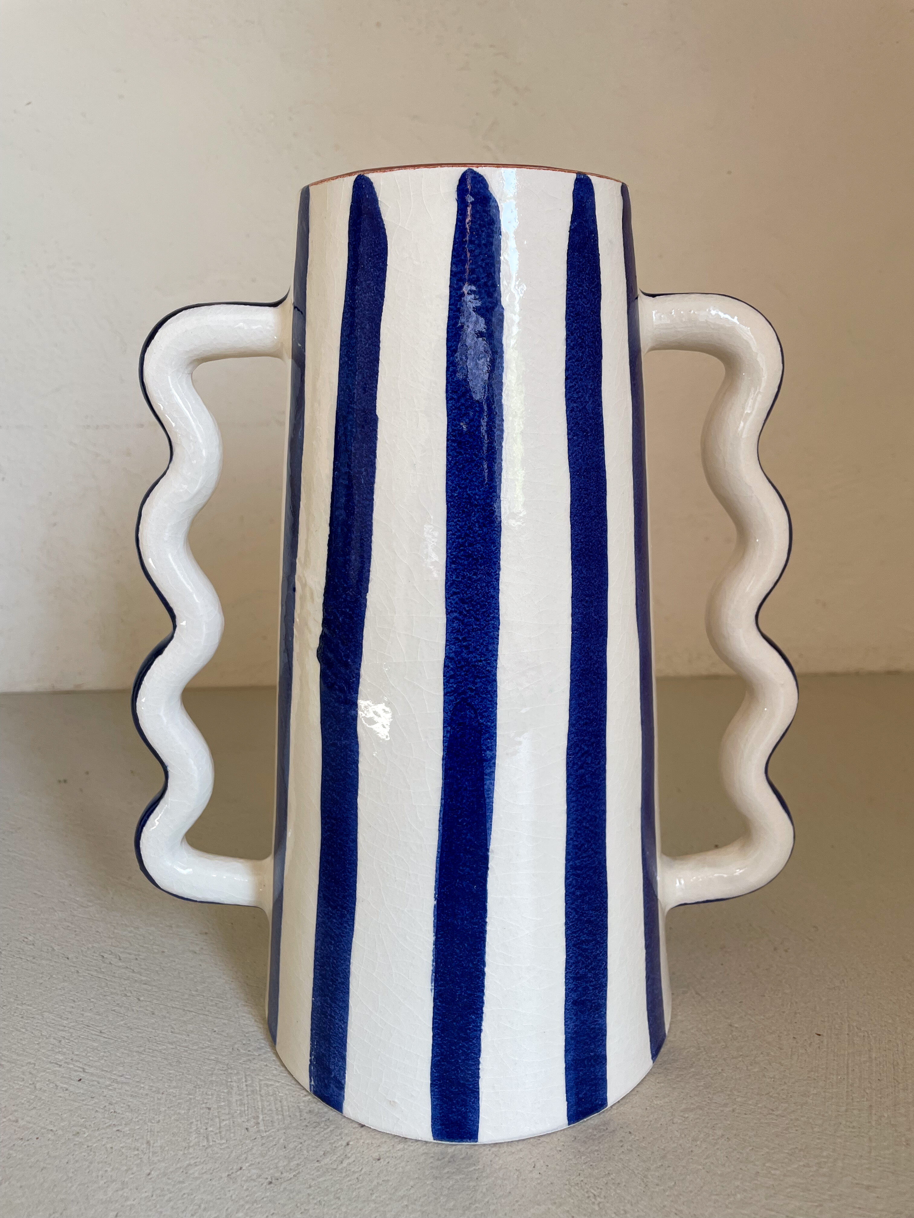 Klein blue and white striped ceramic vase with abstract handmade wavy handles