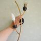 Pair of stylized 2-branch brass wall lights