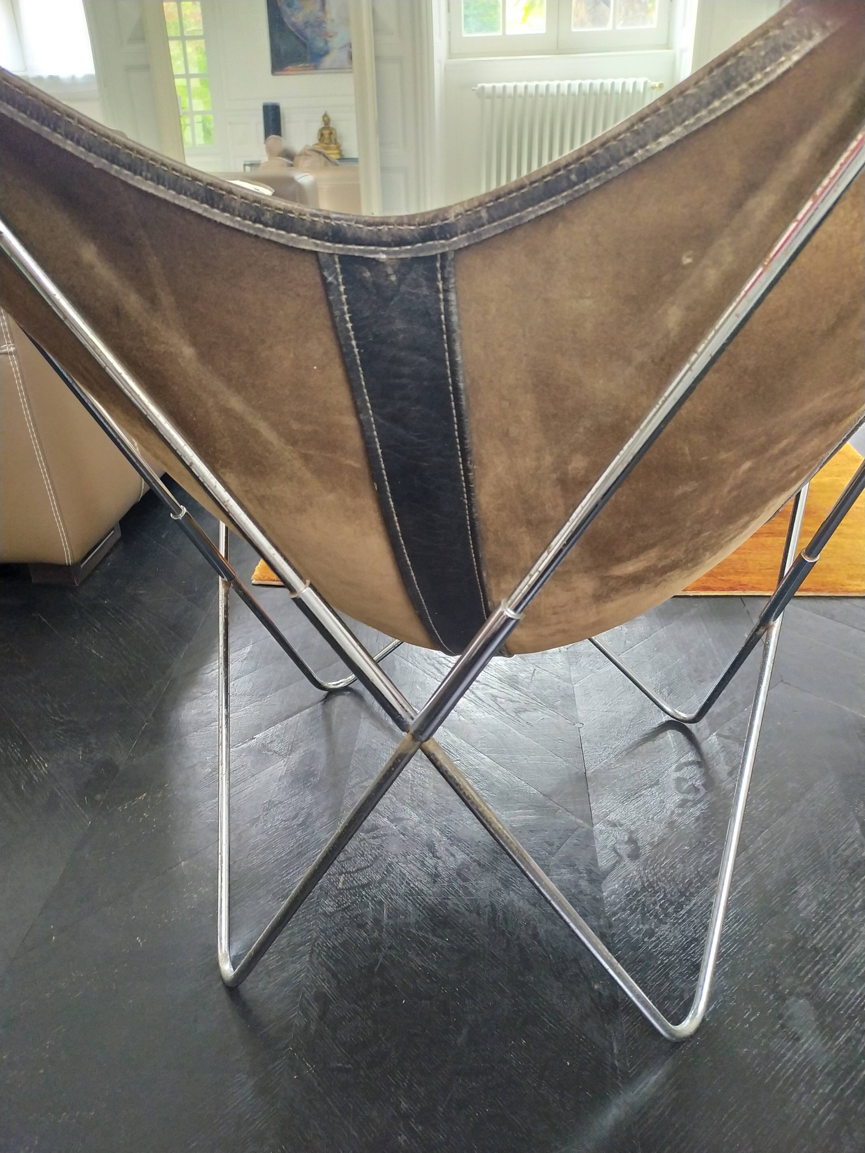 AA Butterfly leather armchairs