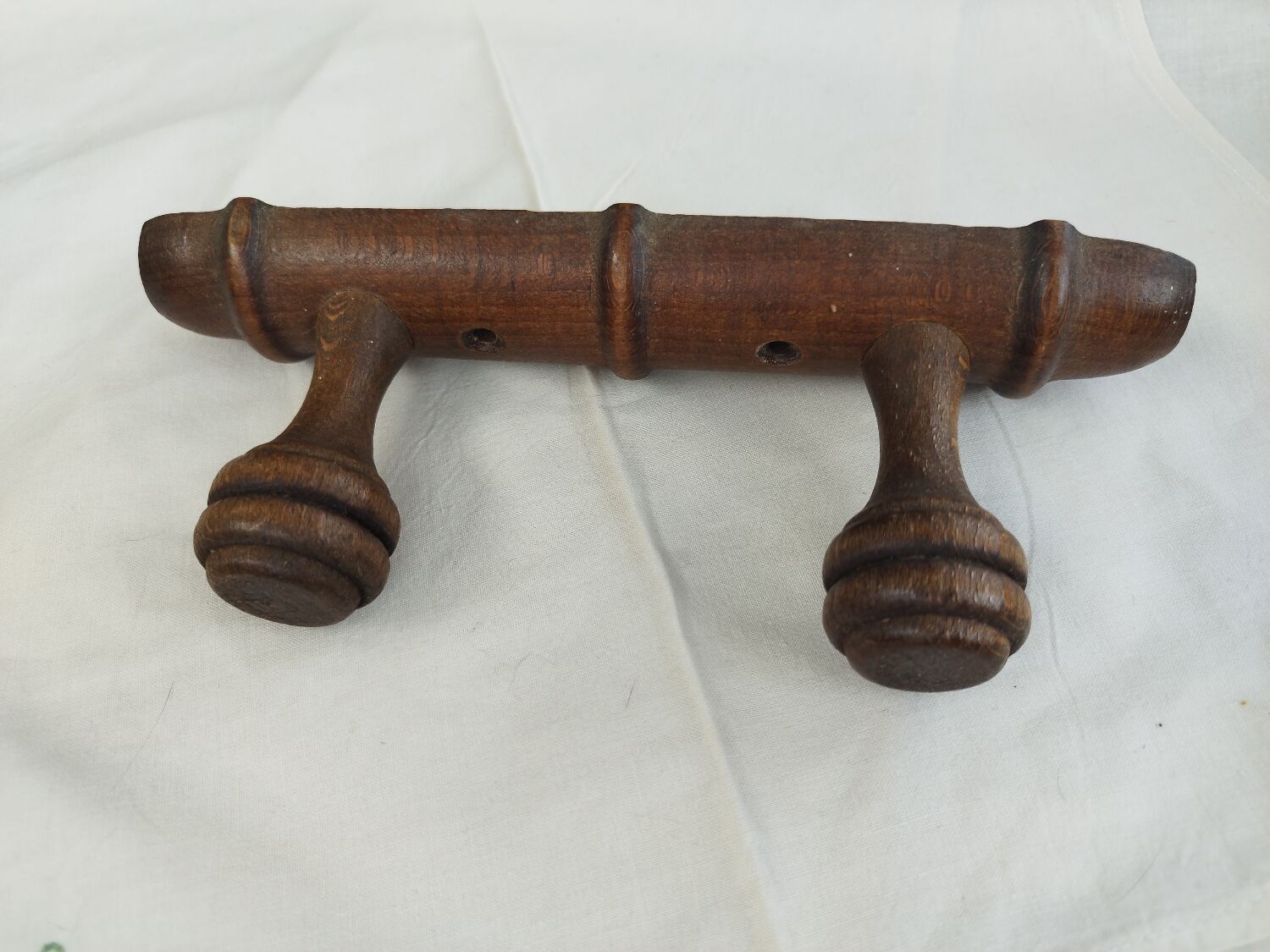 Wooden coat rack turned two hooks