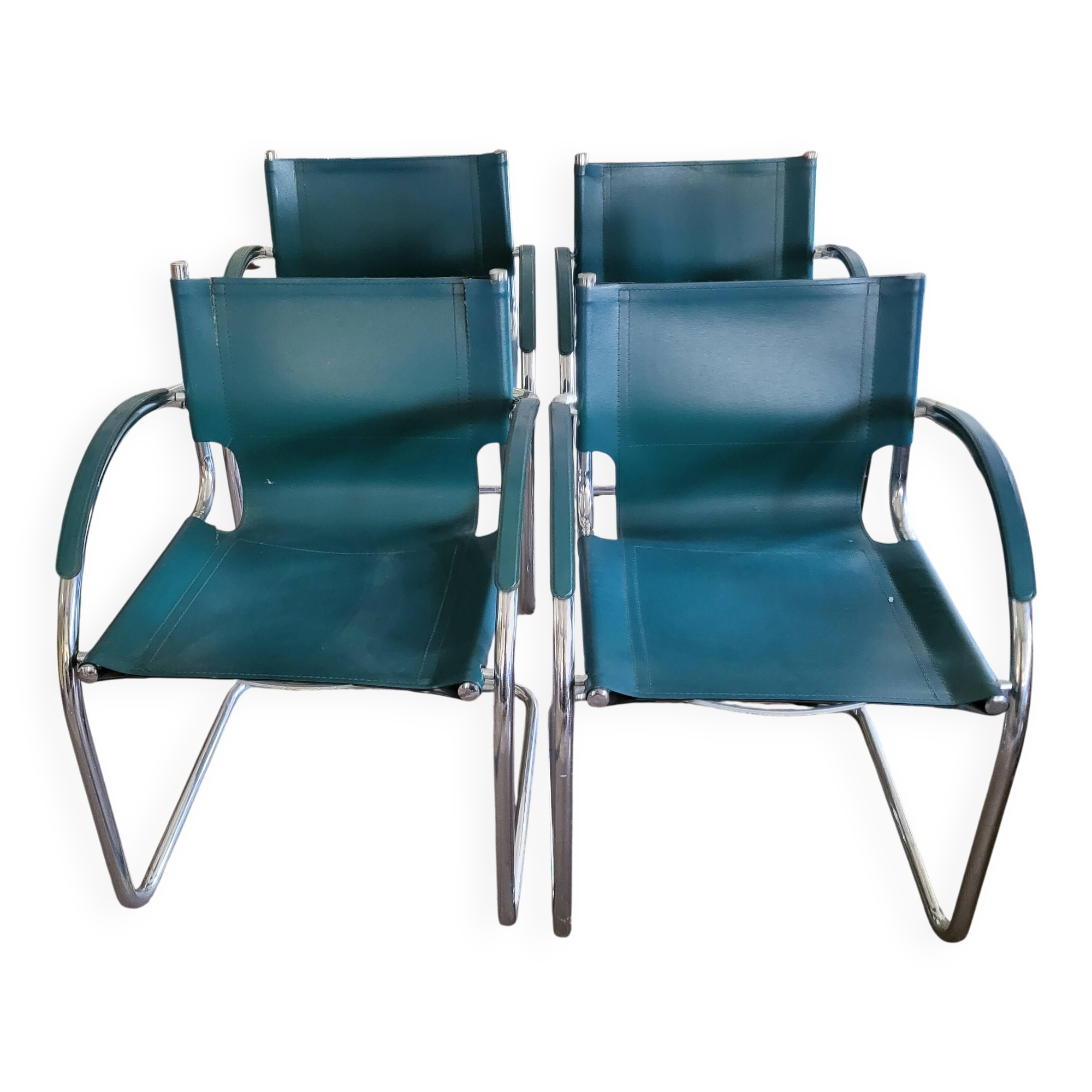 4 vintage Italian armchairs in green leather and chrome metal.